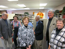 Friends smiling inside new bookstore