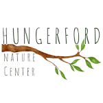 Hungerford Nature Center with tree branch and green leaves