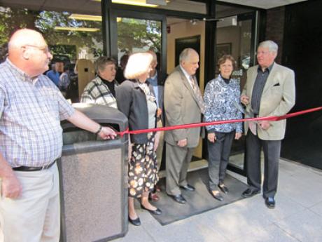 Friends members cutting the ribbon at the Bookstore Grand Opening