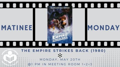 "The Empire Strikes Back" film poster sits in between a film reel